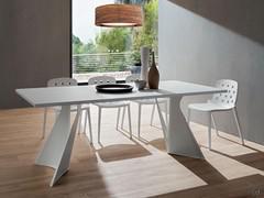 Jeor dining table with design legs in white painted metal and top in white Fenix kos