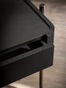 Detail of wooden drawer with curved outer shell and lowered top