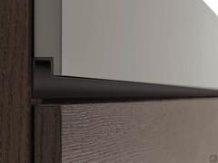 Detail of the metal throat of the Mason sectional nightstand, available in mocha shine finish (photo) or matte lacquer with sample colors