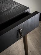 Detail of black ash drawer and brass handle (handle finish not available)