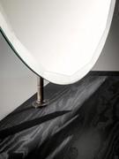 Detail of adjustable mirror attachment - black ash console top (mirror support finish not available)