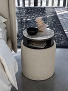 Fabric-covered round nightstand ottoman with marble top and opening drawer