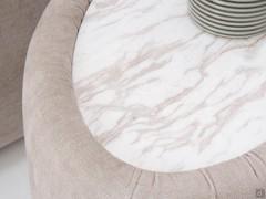 Detail of the top in glossy gold Calacatta marble