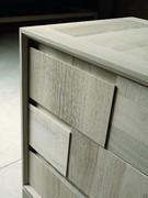 Detail of gray walnut frame with sawn effect drawers