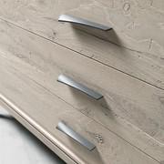 Detail of the rough cut oak wood drawers and metal handles