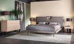 Master bedroom furnished with the collection Mirage: chest of drawers with 3 drawers, pair of rectangular nightstands and in the center the upholstered bed