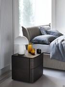 Focus on the bedside table with 2 drawers in the Charcoal Oak finish