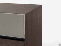 Detail of the two-tone fronts of Mason chest of drawers, a finish that matches matt lacquers and wood veneers