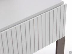 Detail of the slatted fronts of the nightstand Oyster, also available in a smooth version