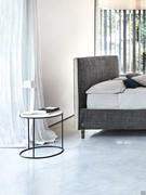 Heliodoro coffee table with a closed metal base used as a bedside table