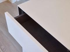 Interior of drawers in grey textured veneer