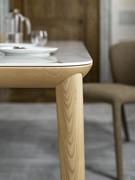 Extendable table in ceramic and Oak wood with a modern design and rounded edges