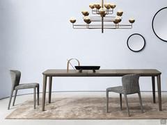 Redmoon extending table with a ceramic top and tapered wooden legs