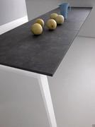 Detail of Clancy wall-mounted table with Delta leg and graphite Cleaf laminate top