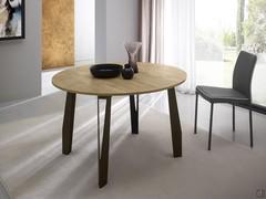 Round table with central extensions Space modern