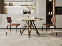 Round table with folding extension, perfect for kitchens or open spaces. Station is a practical solution yet characterised by well-made details.