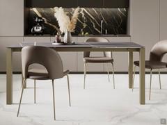 David table with structure in bronze painted metal and matt ceramic stone top in sahara noir