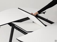 Central folding extension mechanism on round extendable Biblos table models with laminate top