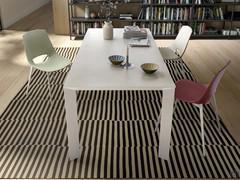 Profile extending table in white Cleaf laminate, with metal frame painted to match the top