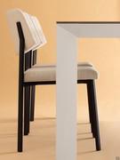 Detail of the painted metal structure of the Profile table, here coordinated with the Omnia chairs