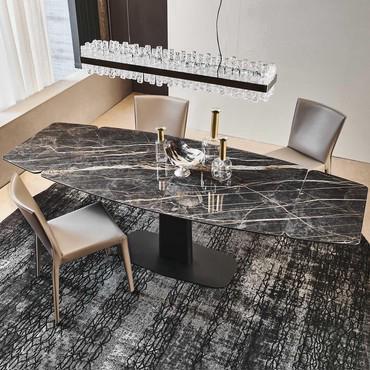 Linus extending table by Cattelan with black chrome base and continuity of texture between the top and the extension leaves