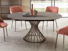 Amos extendable round table, with the central folding extension to reach a width of 170 cm