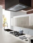 View of the island with flush-mount flush-mount sink and steel gas cooktop: at the back, the glossy lacquered wall units