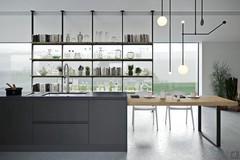 View of the sink area and wood veneer peninsula table: in the background, the bookcase with posts coordinated with the custom kitchen