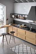 Worktop with peninsula and stove topped by the distinctive chimney hood