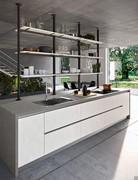 Second floor of the kitchen island and sink topped by the bookcase with posts: the shelves are made of ecoresin coordinated with the base units