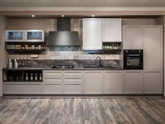 Kitchen with oven column and fridge, wall units, display cases and shelves