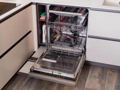 AEG dishwasher with hidden storage compartment for detergents and sponges