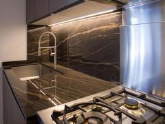 Detail of Laminam Noir Desire Glossy top and wall backsplash, undermount recessed sink - customer photo