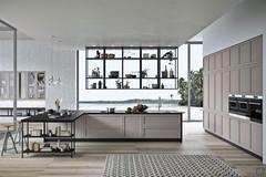 The kitchen island with overhead bookcase is the ideal solution for an open space