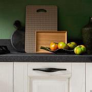 Detail of the pairing between the white pickled door and the stone-like laminate top