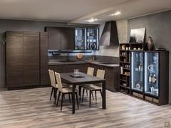 Corner modern kitchen with display case with two doors, wall units with glass doors and internal led lights