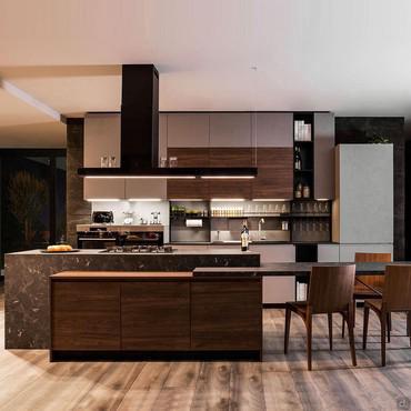 Eat-in kitchen with island with table connected to the cooking area; equipped with a linear kitchen with fridge, sink, wall units, half columns with oven and wine cellar