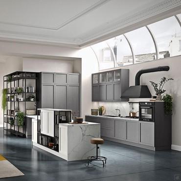 Horseshoe kitchen for open space, with double-sided wall island, columns, burner area, sink and raised oven