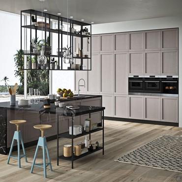 Fifty 05 is an equipped corner kitchen island with a cooktop with integrated hood, sink, countertop and peninsula table