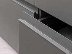 Detail of the lacquered horizontal recess grip of the drawers