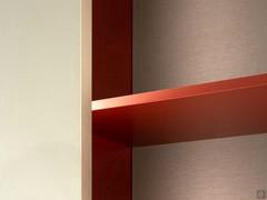 Detail of the shelf in Amaranth matt lacquer