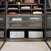 Detail of the internal equipment: shirt rack and chest of drawers with glass fronts