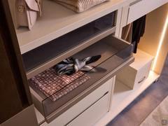 Detail of drawers with smoked glass front, matt lacquered exterior handle and sand sketch melamine frame