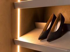 Close-up of the sloped shoe-rack shelf with varnished titanium metal heel-stop (titanium finish not available)