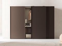 Mud matt lacquered wardrobe equipped with matching suspended drawers and nude matt lacquered skin effect melamine interiors.