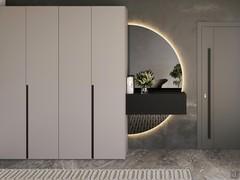 Midley Wide modular wardrobe in an entrance context, combined with a Julius mirror and a Heritage wall-hung base unit.