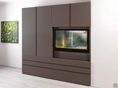 Wardrobe with Wide TV module combined with a door and drawer module, also from the Wide collection