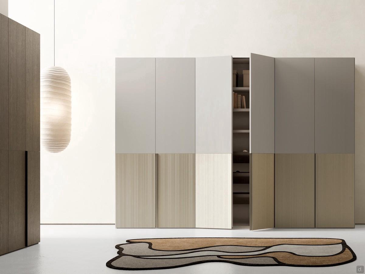 Wardrobe with Ocean hinged doors: frontally the two-tone matt lacquered solution with bottom panel in polymeric barré. On the side is the single-material solution in fashion oak wood 