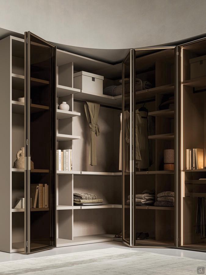 Driver Wide corner wardrobe with folding doors, here proposed with Arctic door in glass and metal, but also available in melamine, lacquer or wood