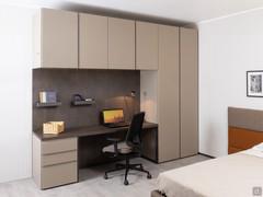 Wide bedroom wardrobe with desk and full-height Midley module, complemented by Wide wardrobe hinged wall units